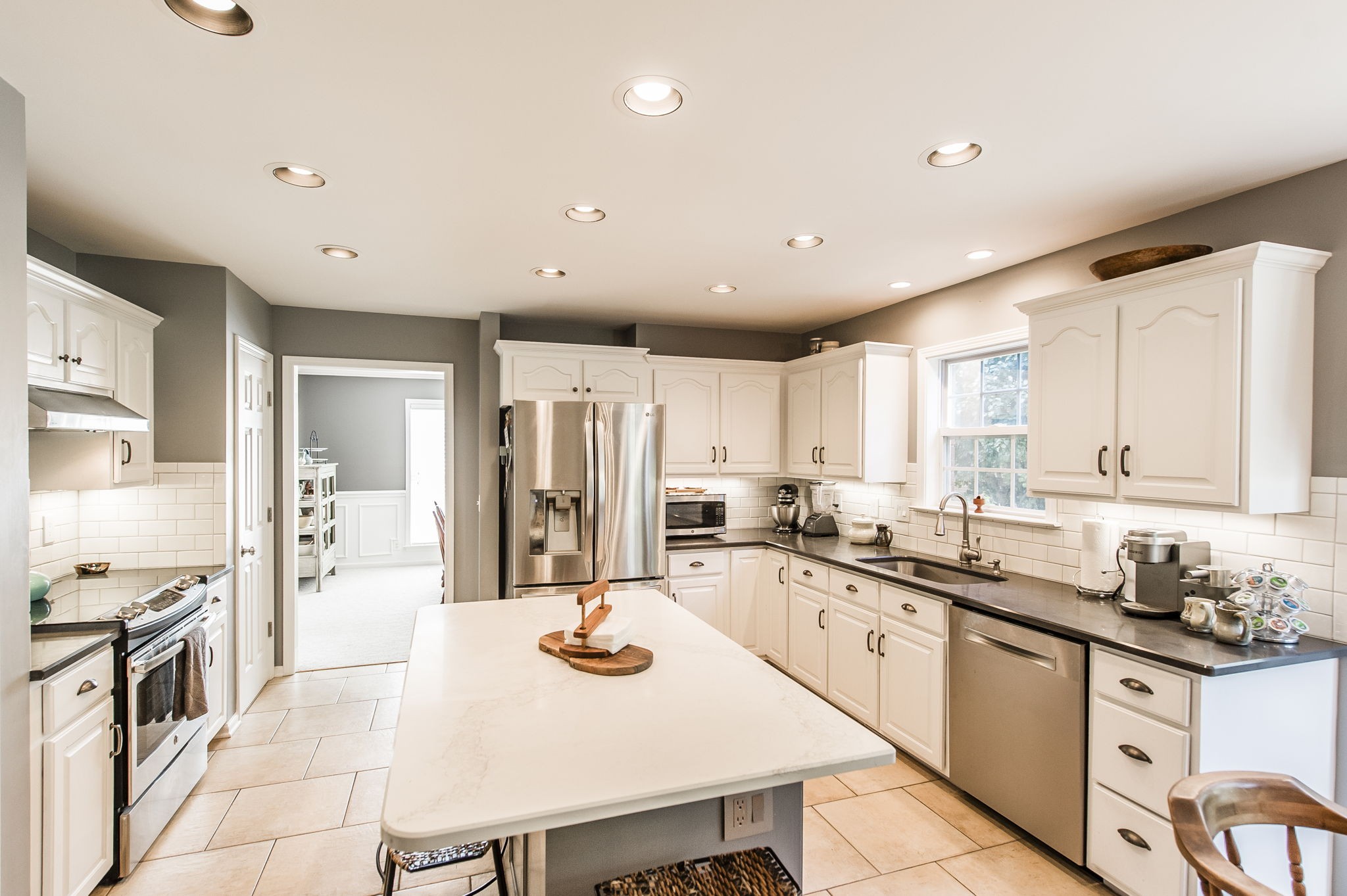317 Cherry Lane White House, TN 37188 - Photo 38 of 70 a kitchen with stainless steel appliances granite countertop a sink and cabinets
