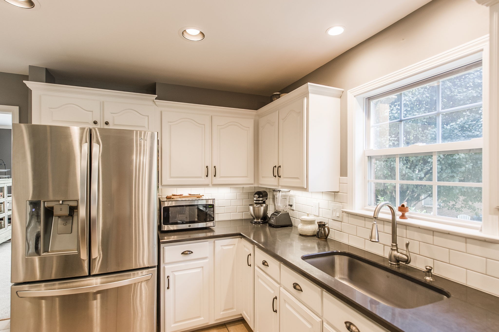 317 Cherry Lane White House, TN 37188 - Photo 39 of 70 a kitchen with stainless steel appliances a refrigerator sink and cabinets