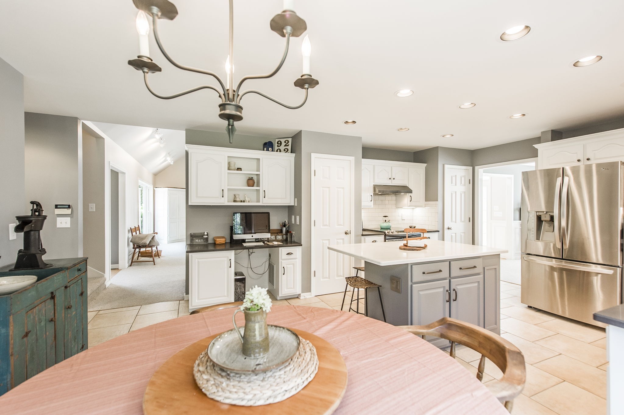 317 Cherry Lane White House, TN 37188 - Photo 43 of 70 a kitchen with stainless steel appliances granite countertop a sink dishwasher a refrigerator and a dining table with wooden floor