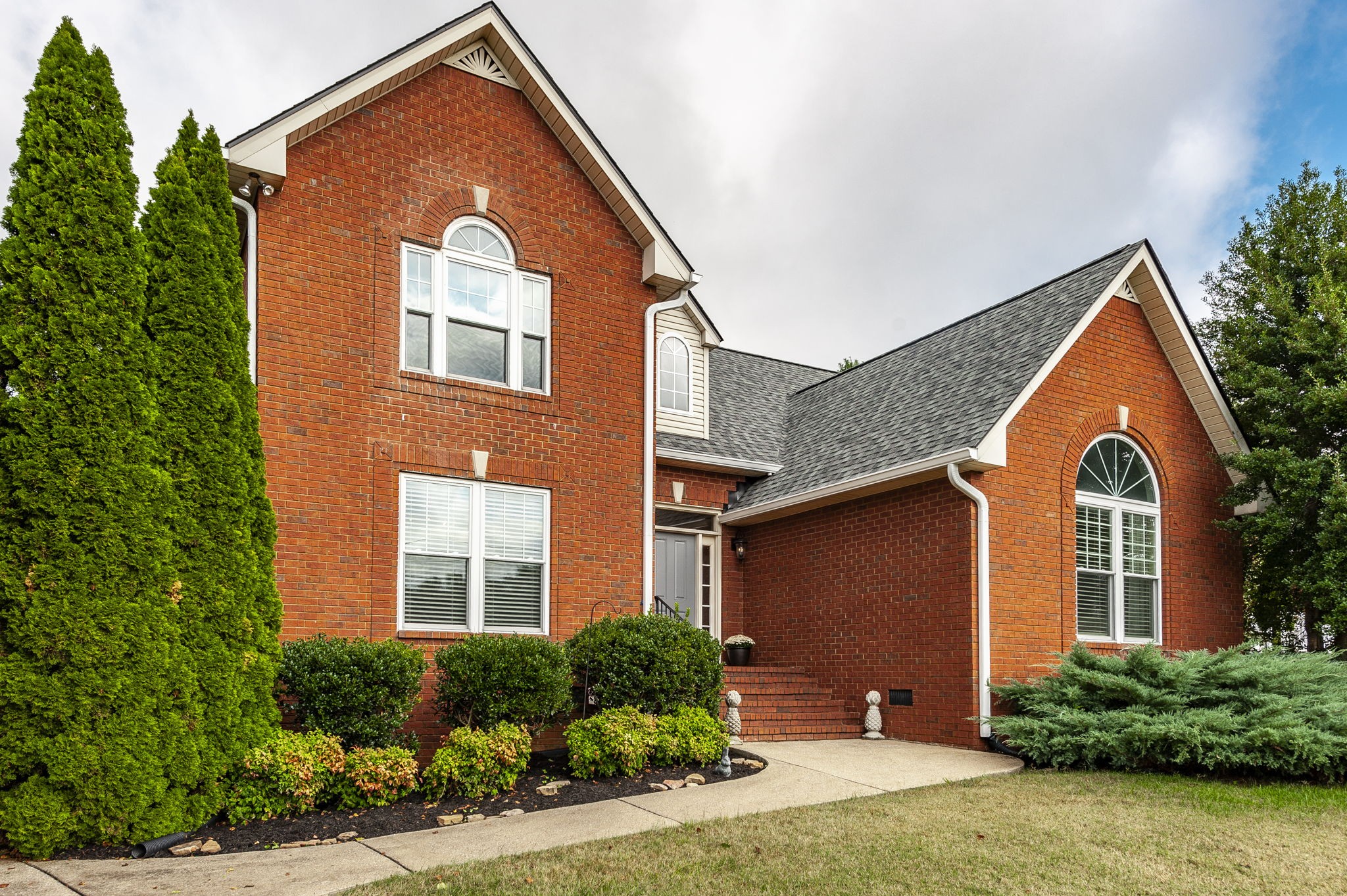 317 Cherry Lane White House, TN 37188 - Photo 6 of 70 a front view of a house with a yard