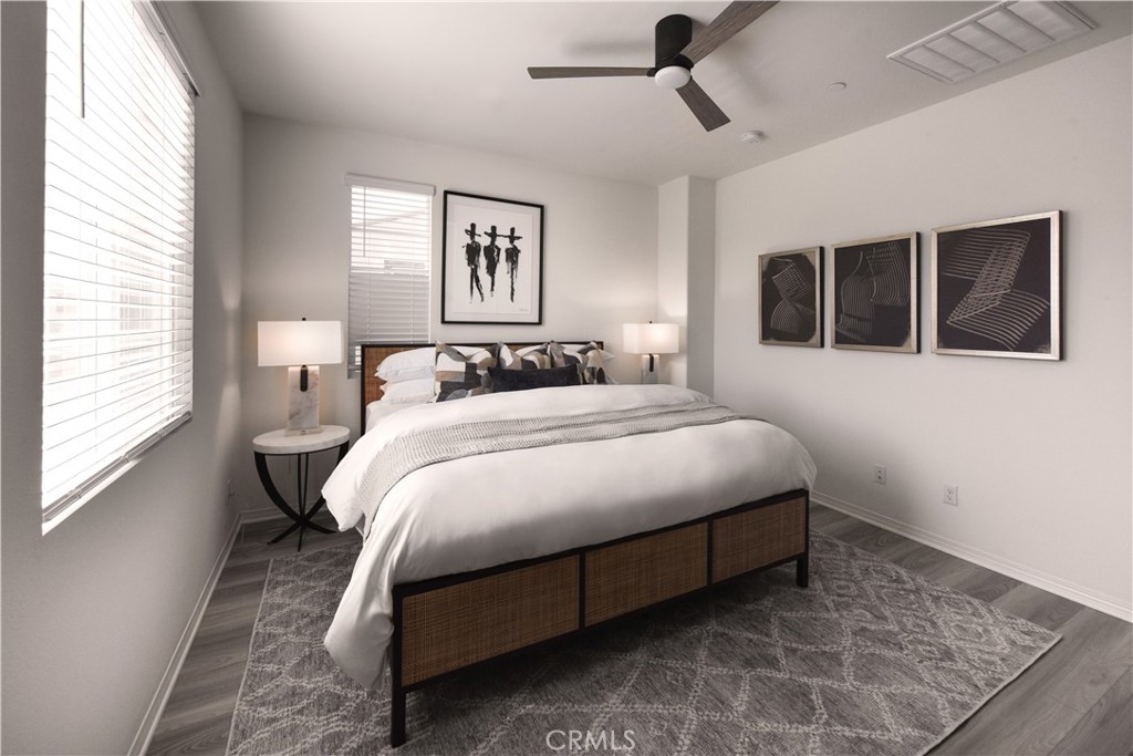 7075 Montecito Lane Eastvale, CA 92880 - Photo 11 of 26 a bedroom with a bed and a window