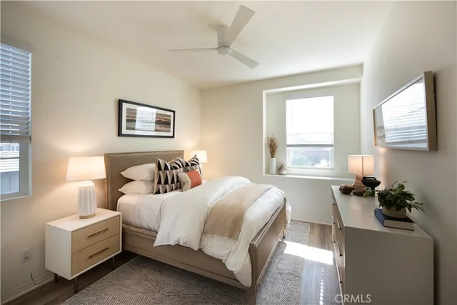 a bedroom with a bed and a couch