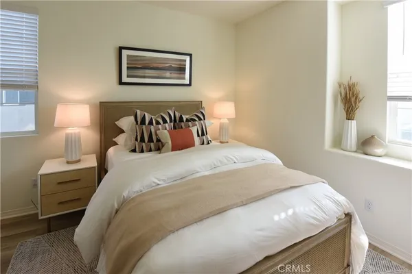 a bedroom with bed and a window