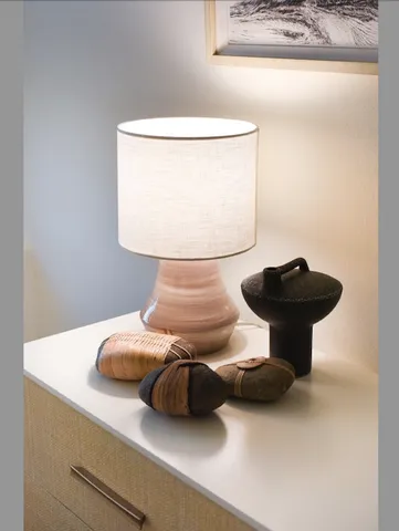 a bedroom with a bed and a table