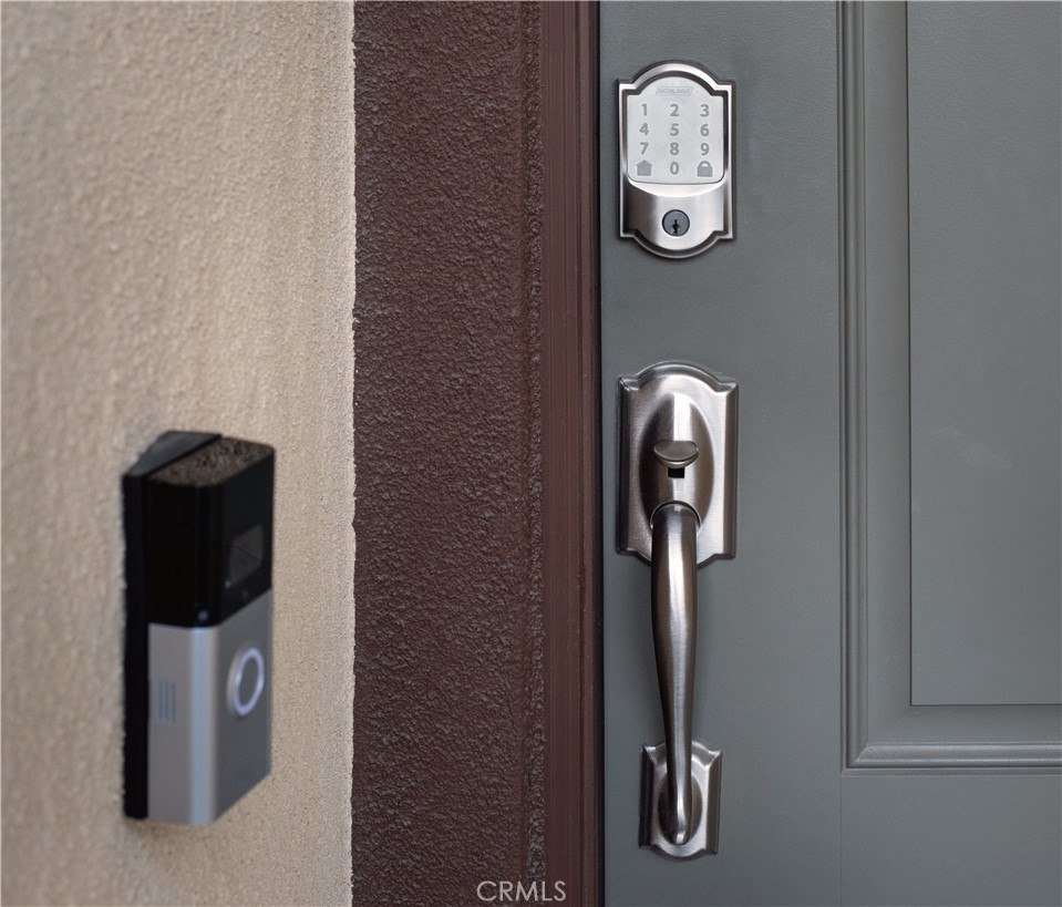 7075 Montecito Lane Eastvale, CA 92880 - Photo 4 of 26 a front view of a entryway with wooden floor