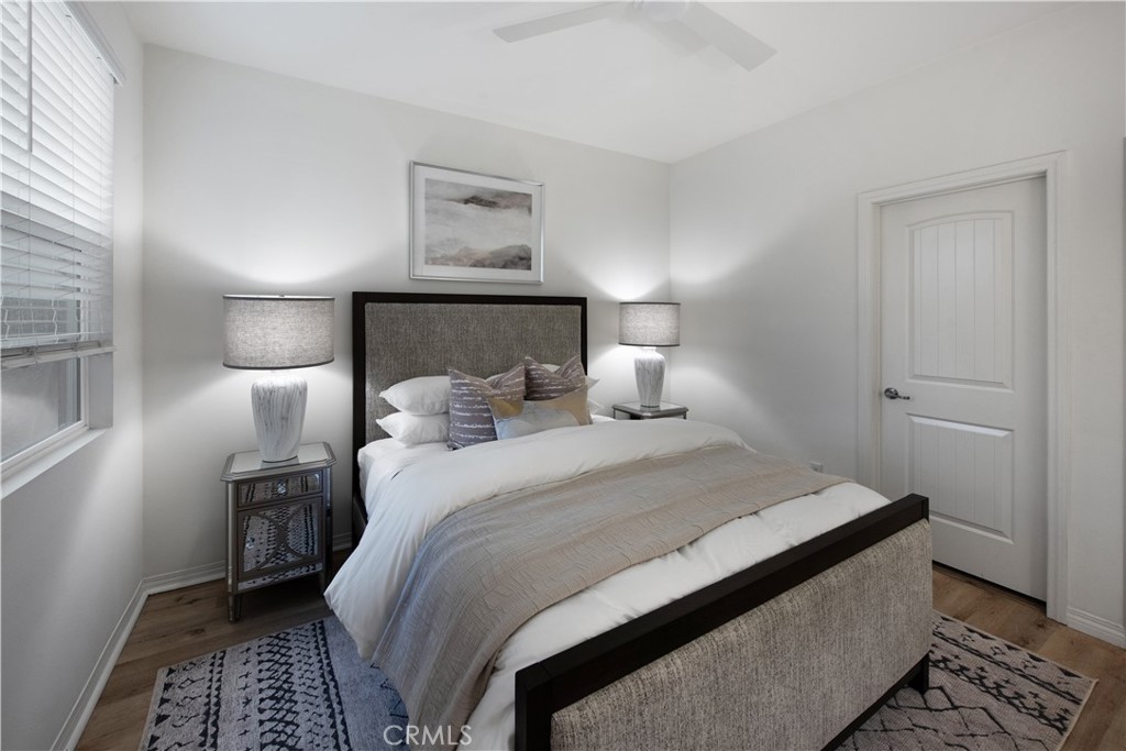 7075 Montecito Lane Eastvale, CA 92880 - Photo 10 of 26 a bedroom with a bed and a lamp