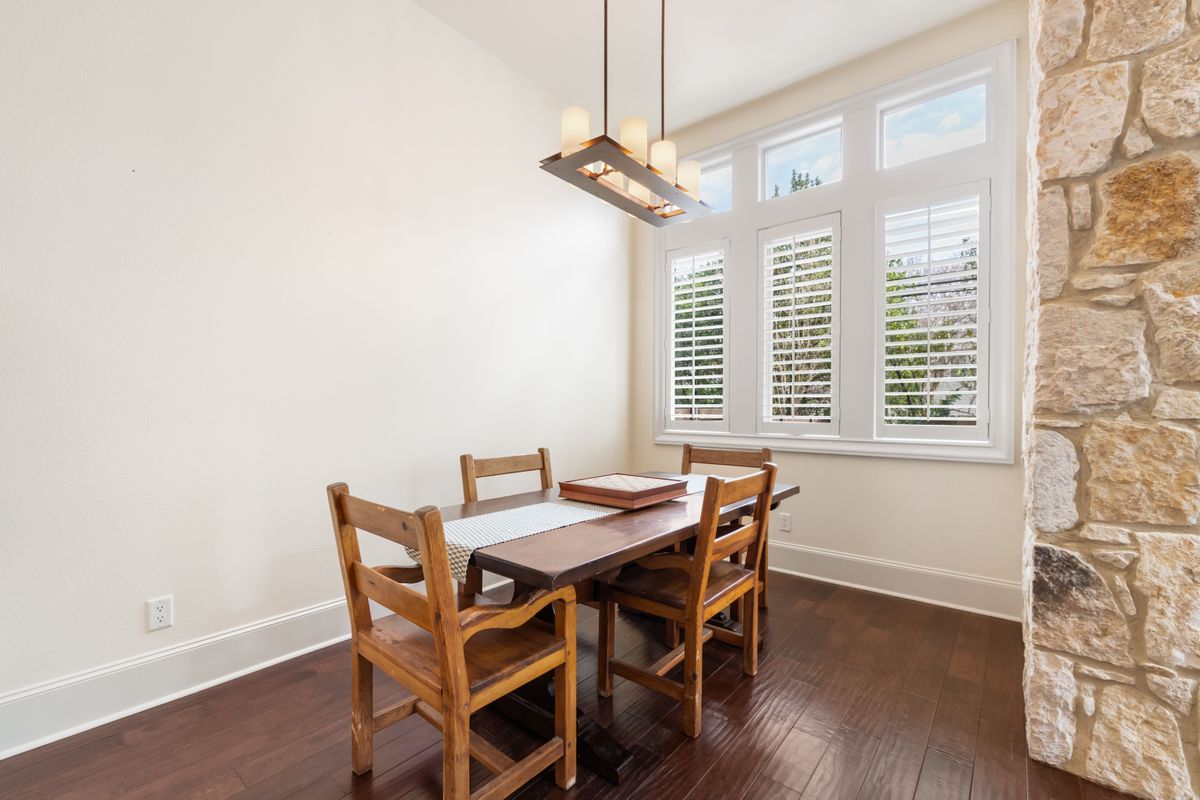 2002 Kinney Avenue, Unit A Austin, TX 78704 - Photo 12 of 26 a view of a dining room with furniture window and wooden floor
