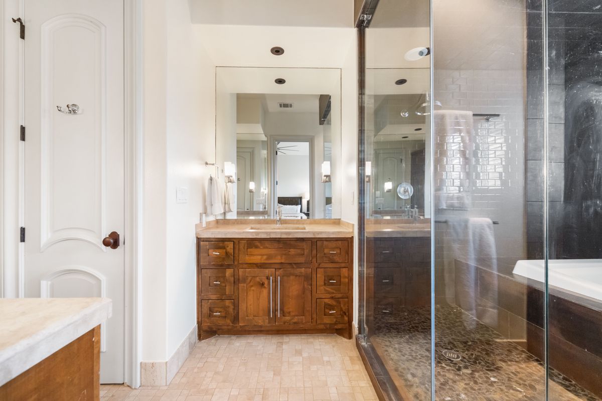2002 Kinney Avenue, Unit A Austin, TX 78704 - Photo 14 of 26 a bathroom with a shower sink and mirror