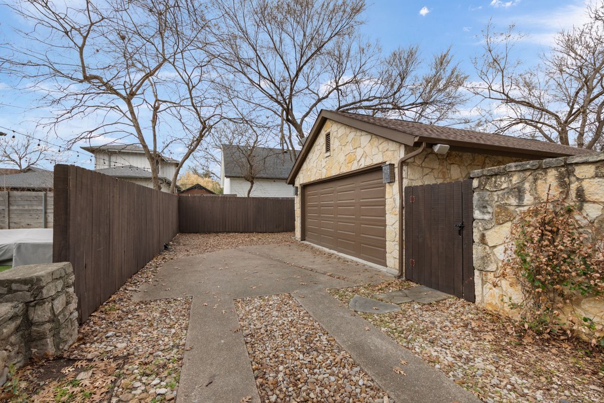 2002 Kinney Avenue, Unit A Austin, TX 78704 - Photo 24 of 26 a view of a wooden house with a large tree
