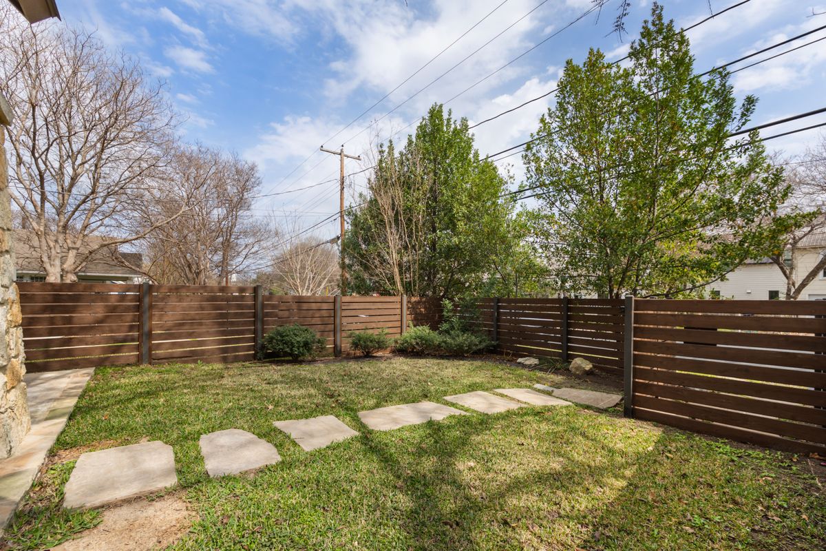 2002 Kinney Avenue, Unit A Austin, TX 78704 - Photo 3 of 26 a view of a yard with wooden fence