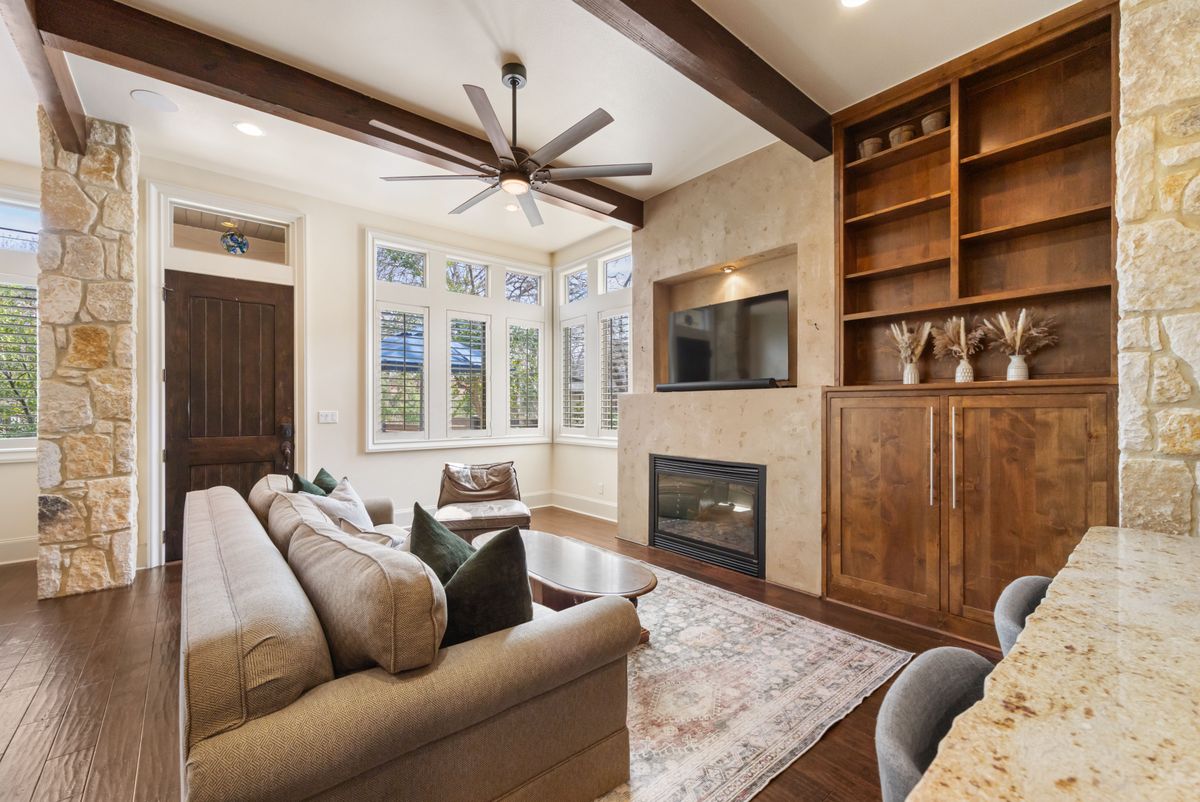 2002 Kinney Avenue, Unit A Austin, TX 78704 - Photo 4 of 26 a living room with furniture windows and a fireplace