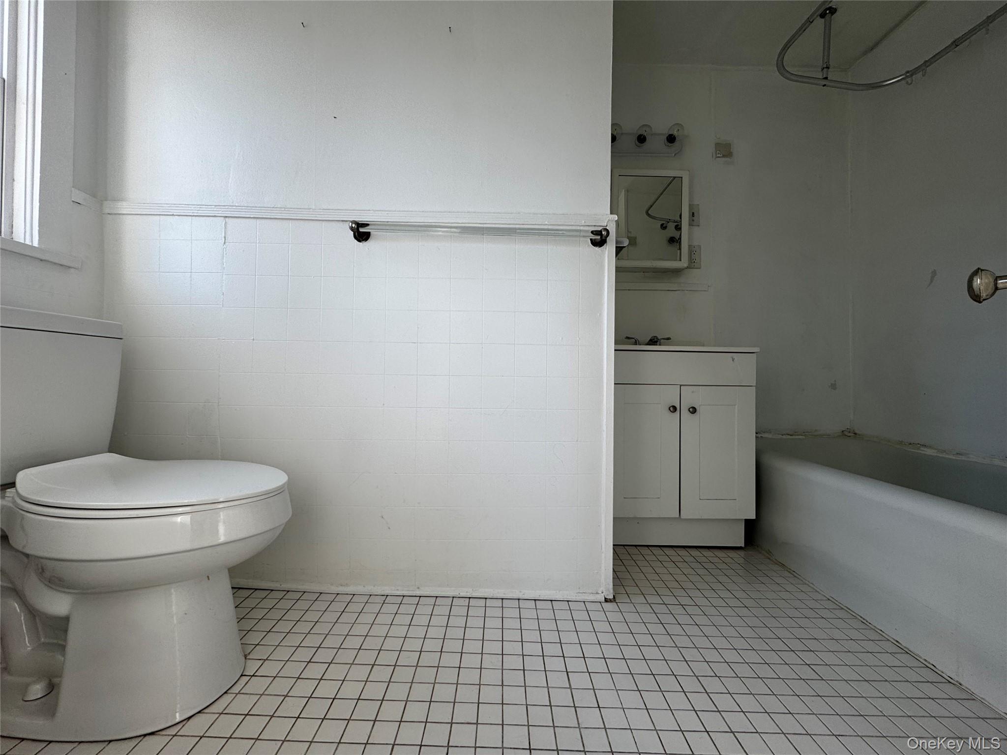 239 West Main Street, Unit 3 Goshen, NY 10924 - Photo 10 of 18 a bathroom with a toilet a sink and bathtub