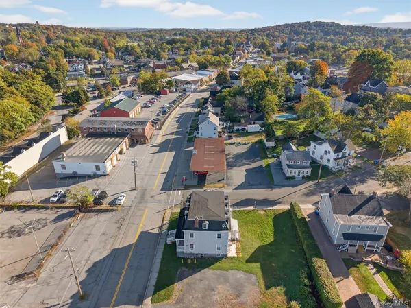 an aerial view of residential houses with outdoor space