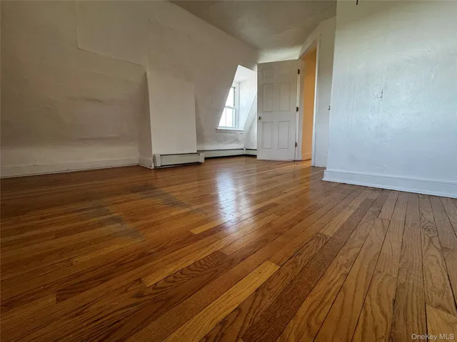 a kitchen with granite countertop a sink stove and refrigerator