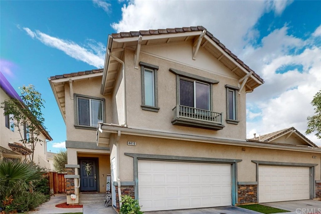 4416 Water Lane Riverside, CA 92505 - Photo 1 of 1 a front view of a house with a small garden