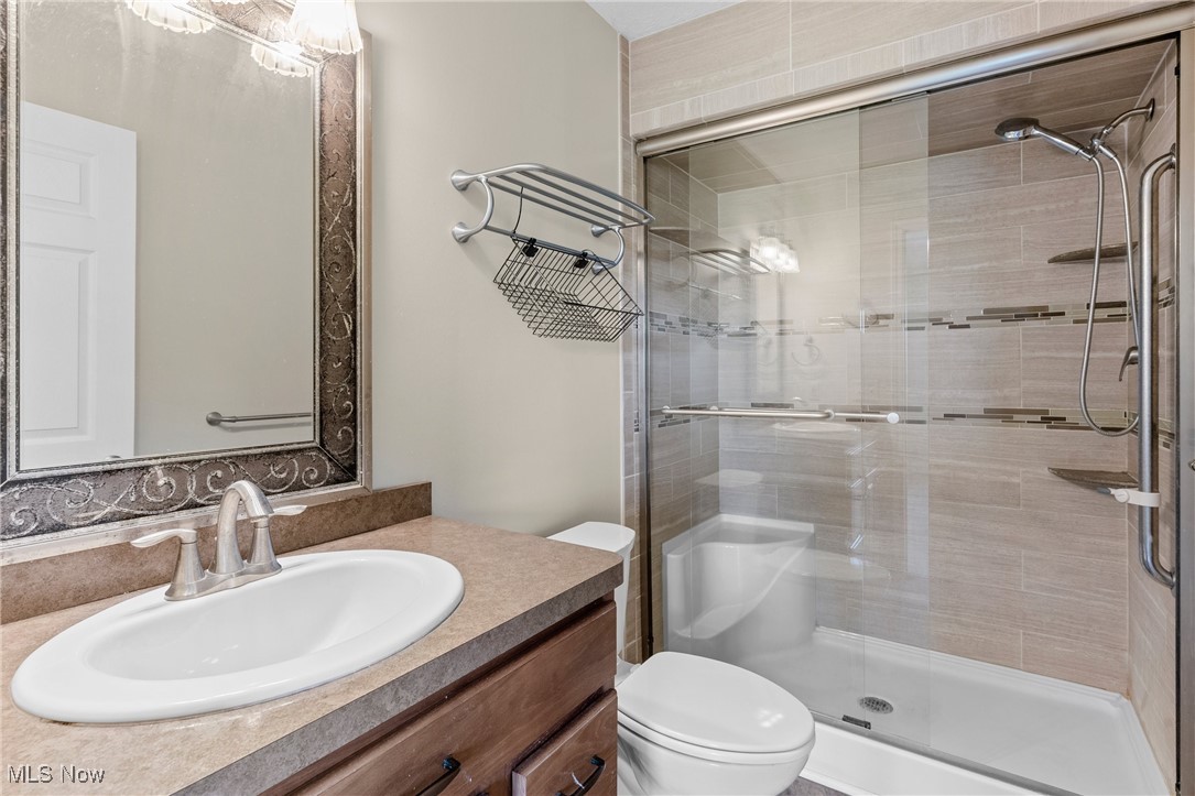 5215 River Road Madison, OH 44057 - Photo 22 of 36 Full bath with a stall shower and vanity