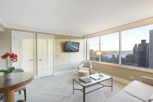 a living room with furniture and a window