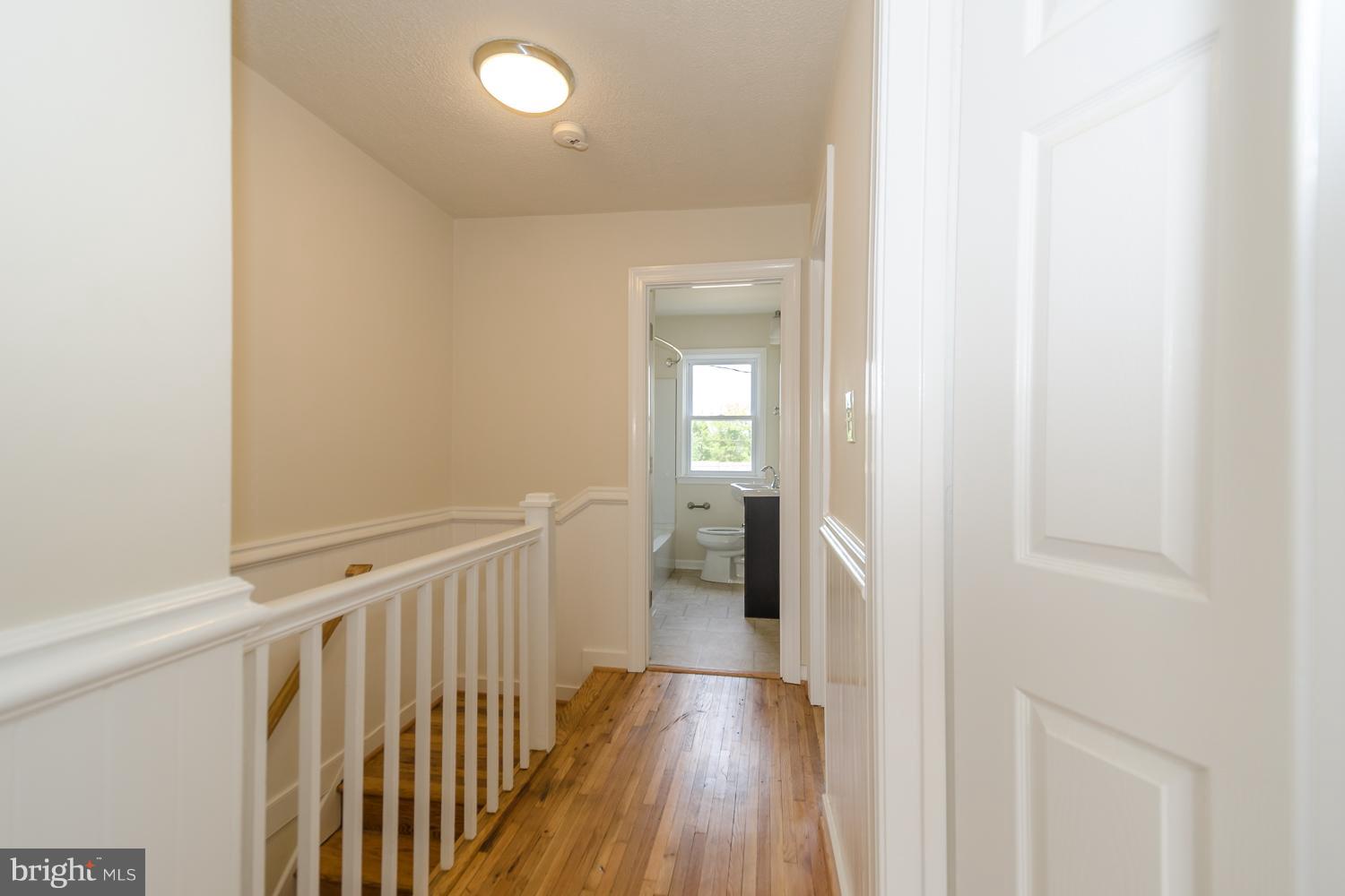 324 Old Riverside Road Baltimore, MD 21225 - Photo 16 of 17 Upstairs Hall! Beautiful Floors!