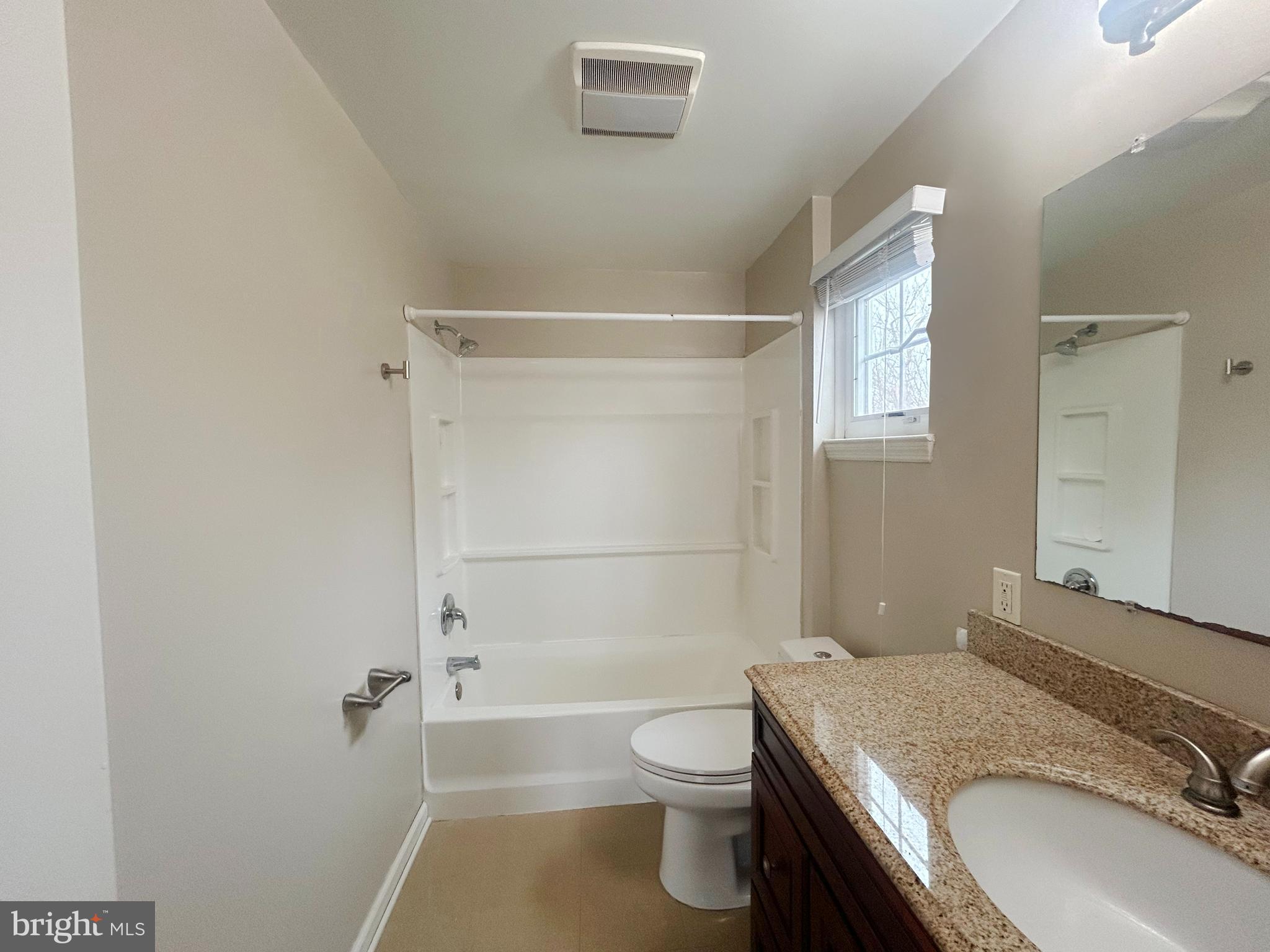 603 Hudson Avenue Pitman, NJ 08071 - Photo 12 of 17 a bathroom with a granite countertop sink toilet and shower