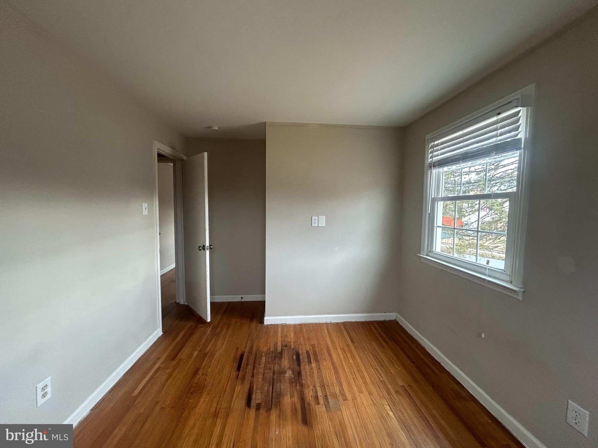 603 Hudson Avenue Pitman, NJ 08071 - Photo 13 of 17 wooden floor in an empty room with a window