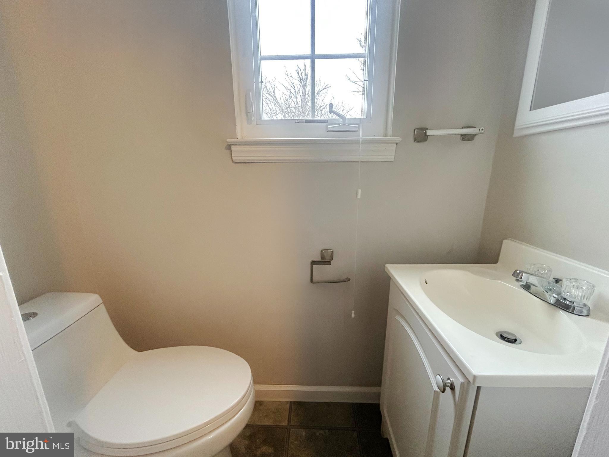 603 Hudson Avenue Pitman, NJ 08071 - Photo 7 of 17 a white toilet sitting next to a bathroom sink