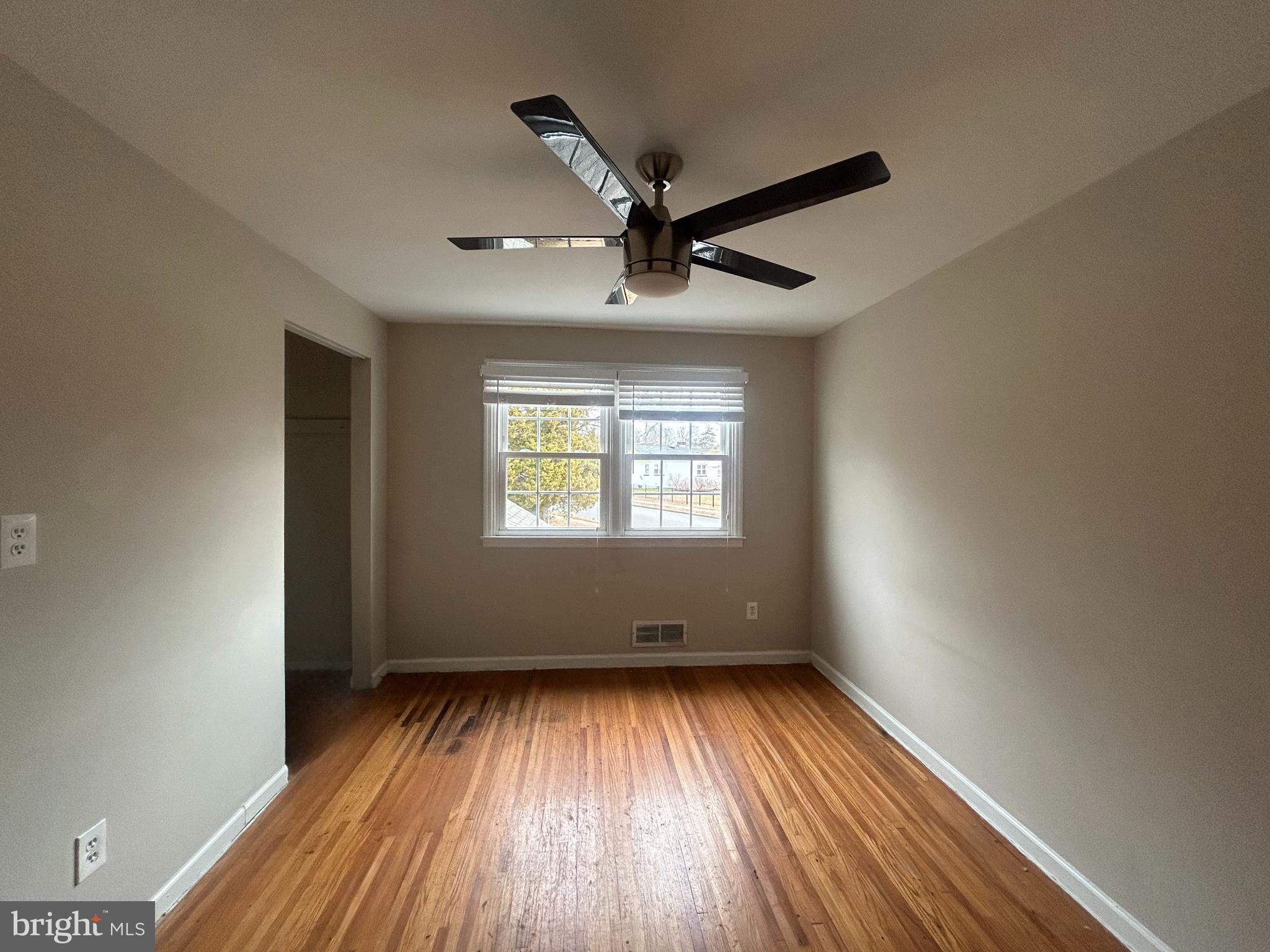 603 Hudson Avenue Pitman, NJ 08071 - Photo 9 of 17 wooden floor in an empty room with a window