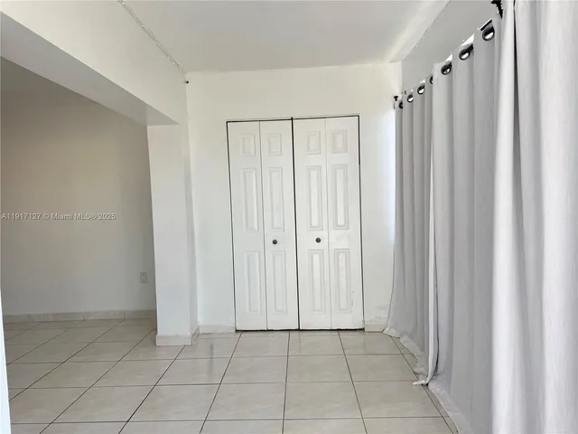 a view of a hallway with a shower