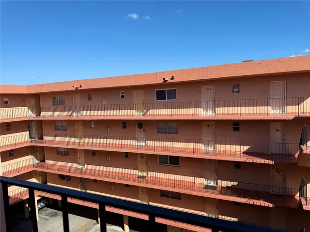a view of a chair and table in a room