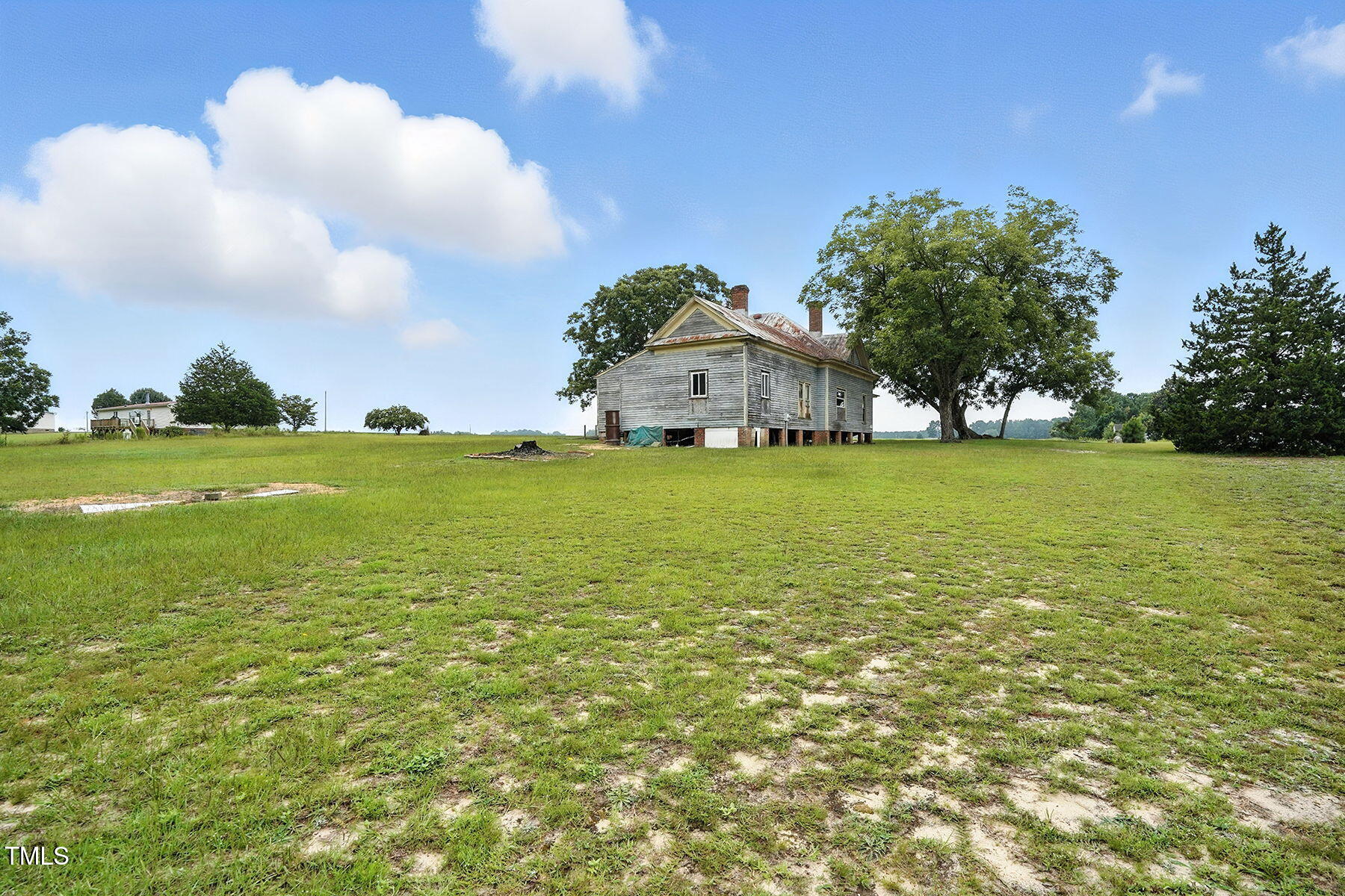 1200 D Morgan Road Benson, NC 27504 - Photo 13 of 35 a view of a large pool with an outdoor space and seating area