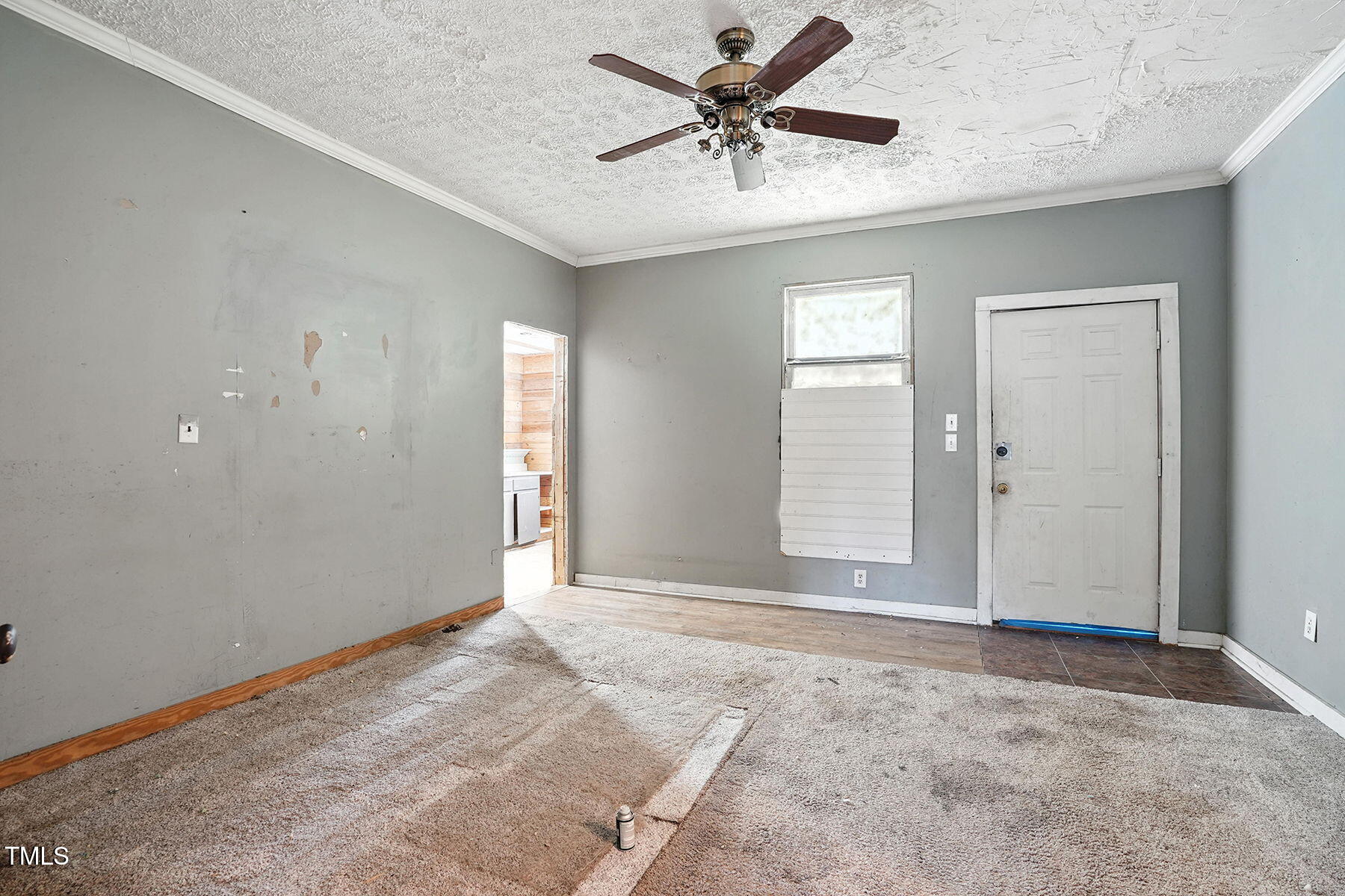1200 D Morgan Road Benson, NC 27504 - Photo 22 of 35 an empty room with a ceiling fan and window