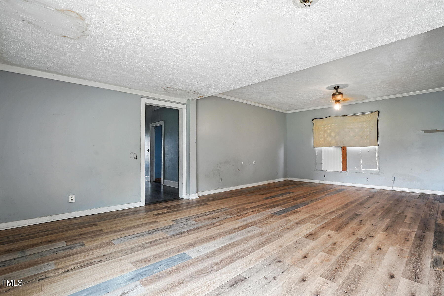 1200 D Morgan Road Benson, NC 27504 - Photo 25 of 35 a view of an empty room with wooden floor and a window