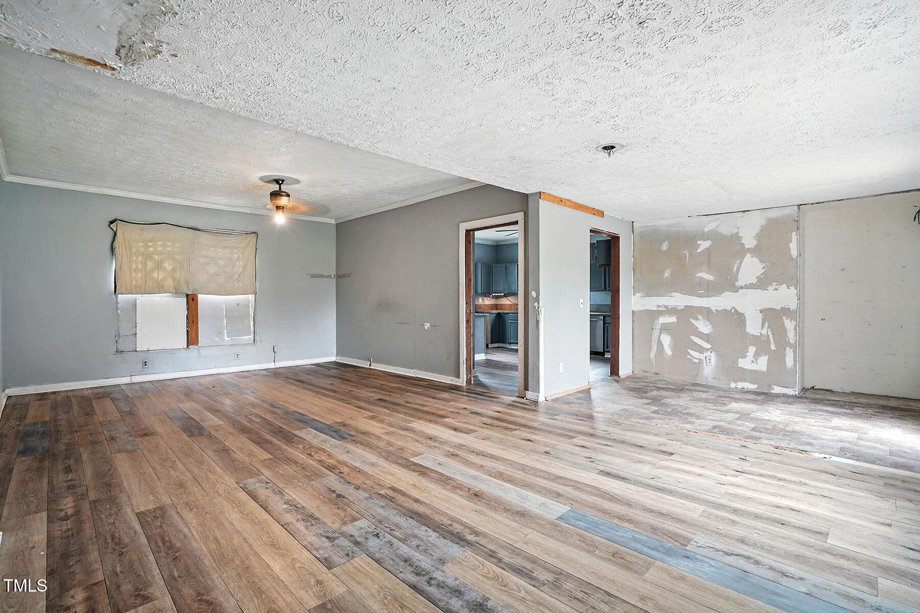 1200 D Morgan Road Benson, NC 27504 - Photo 26 of 35 a view of empty room with wooden floor and fan