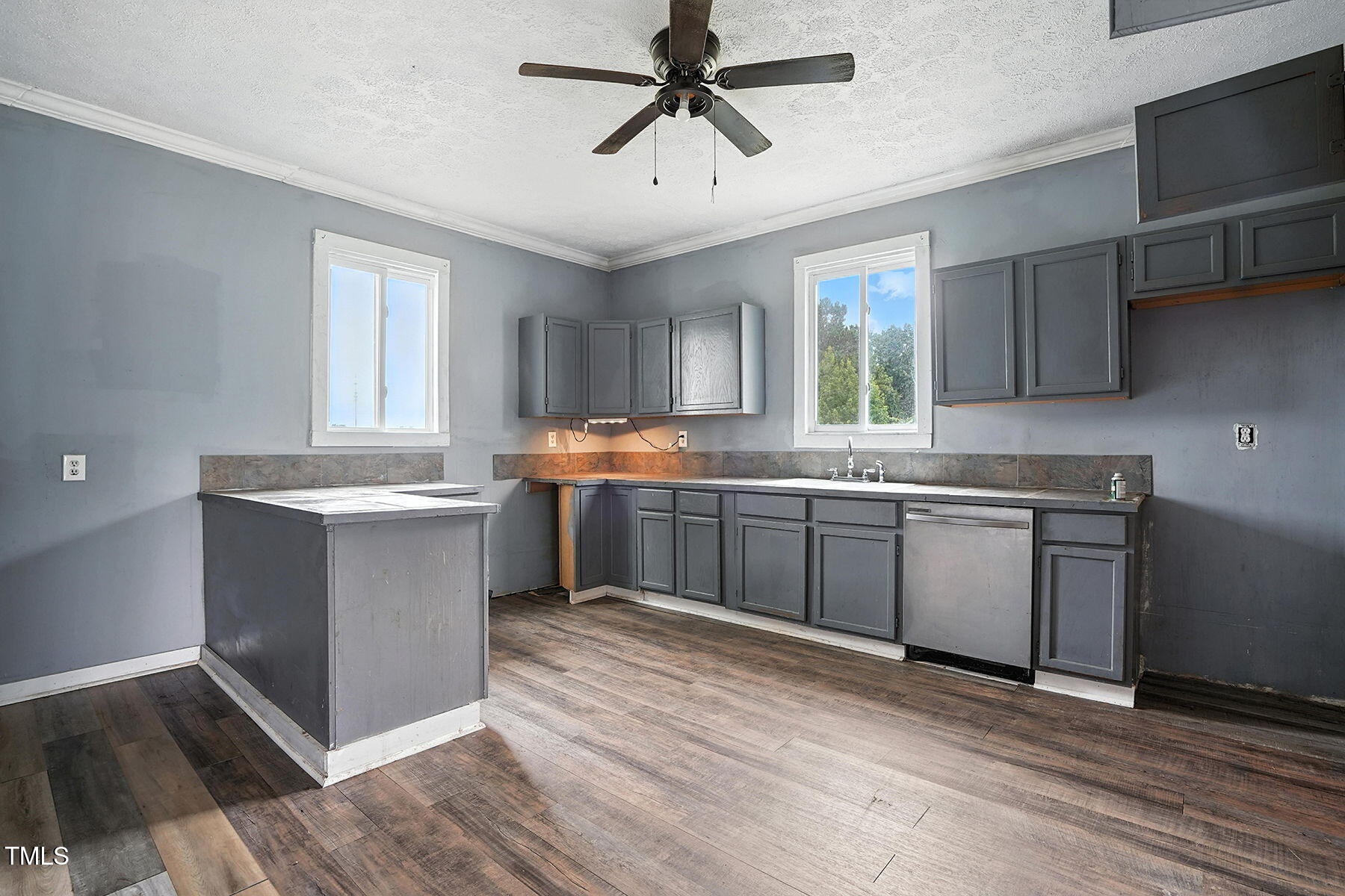 1200 D Morgan Road Benson, NC 27504 - Photo 27 of 35 a kitchen with a sink window and cabinets