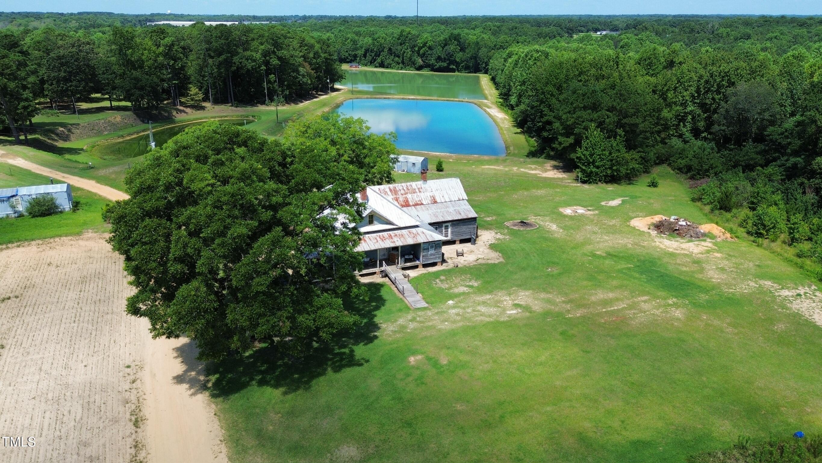 1200 D Morgan Road Benson, NC 27504 - Photo 3 of 35 a swimming pool with some trees in the background