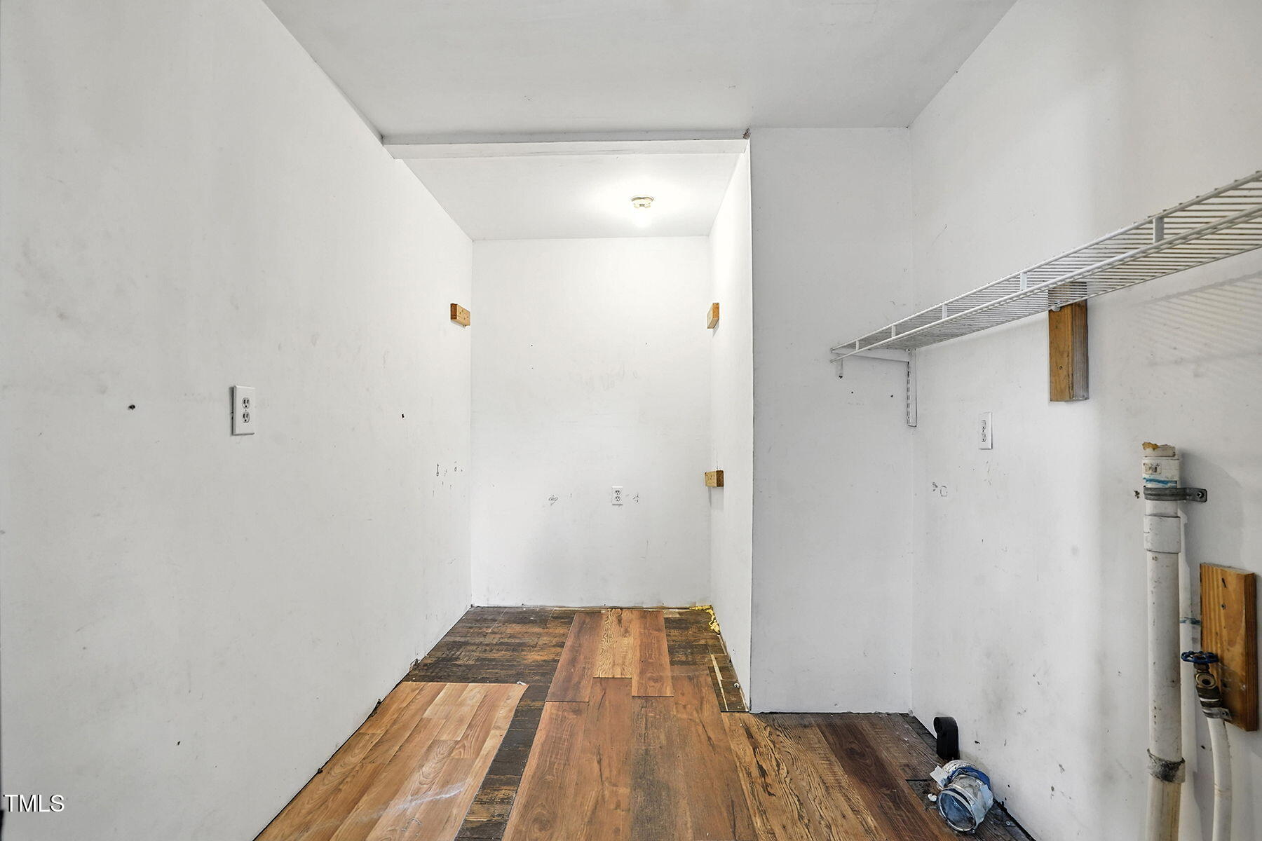 1200 D Morgan Road Benson, NC 27504 - Photo 31 of 35 a walk in closet with wooden floor