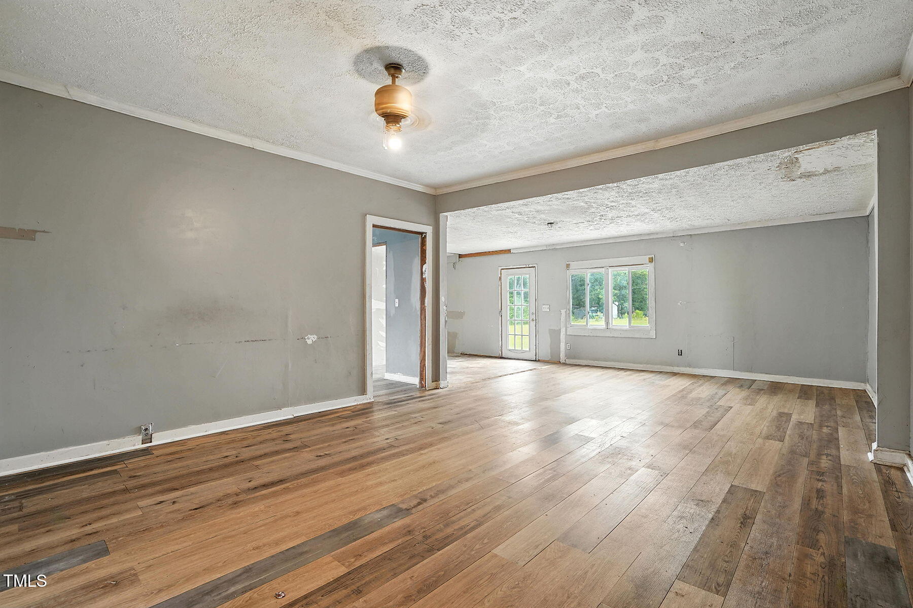 1200 D Morgan Road Benson, NC 27504 - Photo 33 of 35 a view of an empty room with a window and wooden floor