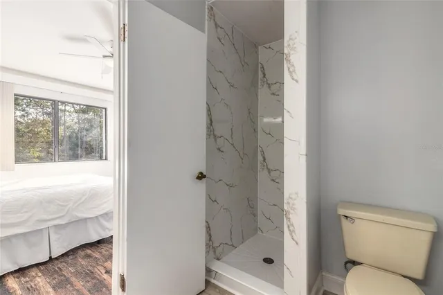 a bathroom with a shower and a toilet