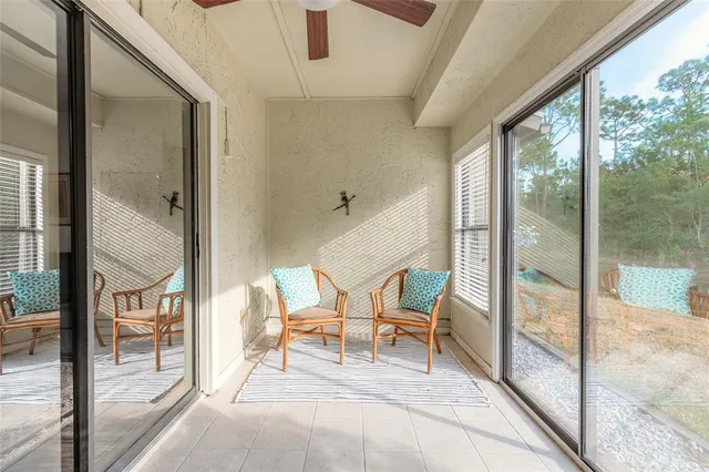 a view of a hallway with chairs