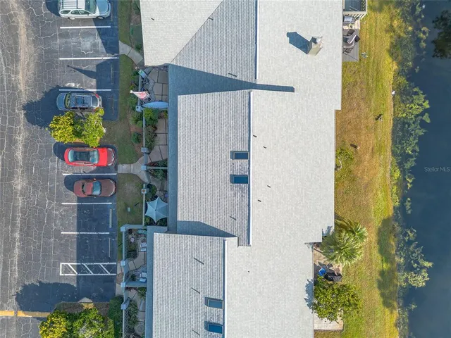 an aerial view of residential house with outdoor space and swimming pool