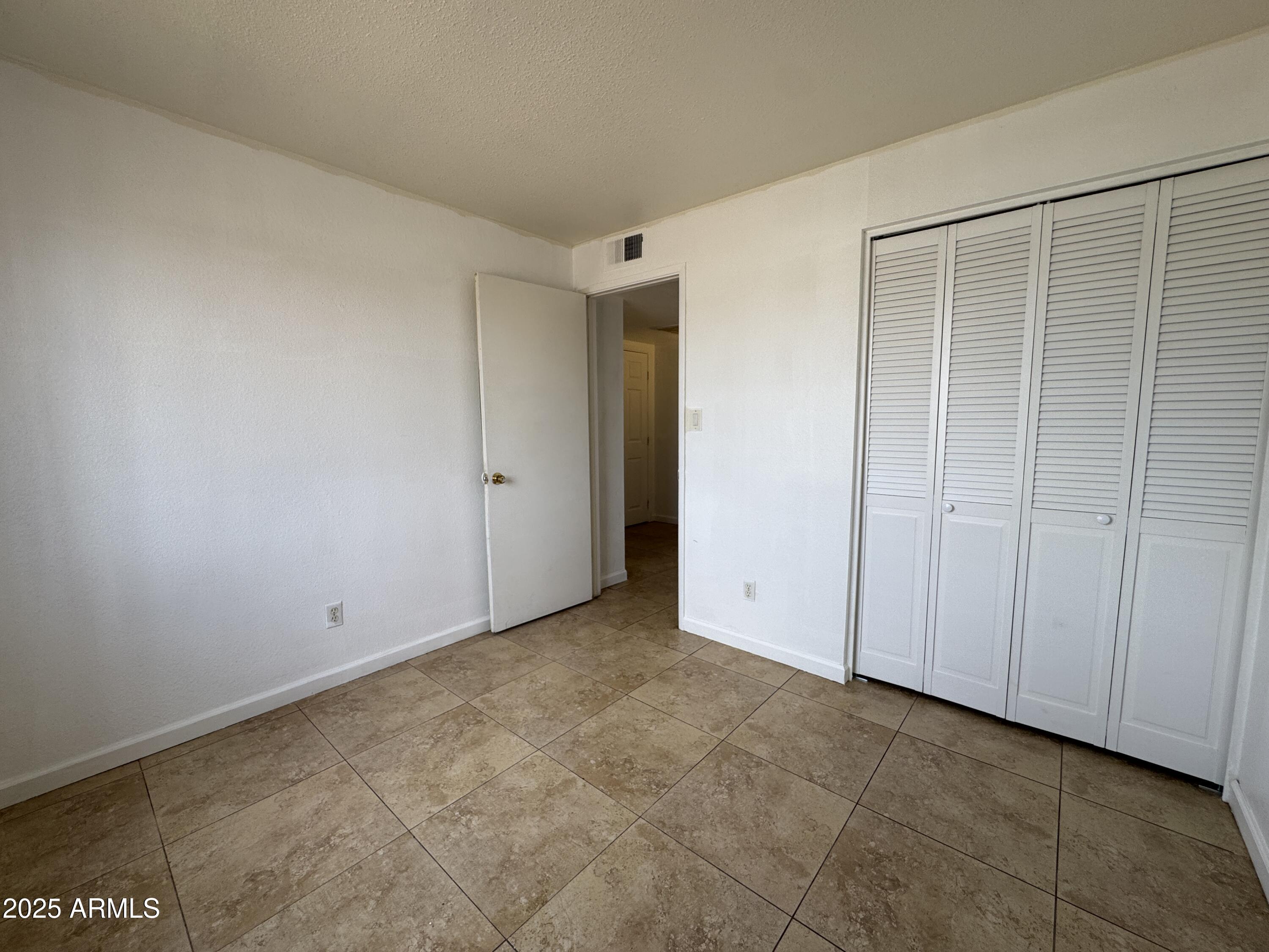 7967 West Highland Avenue Phoenix, AZ 85033 - Photo 11 of 16 a view of an empty room