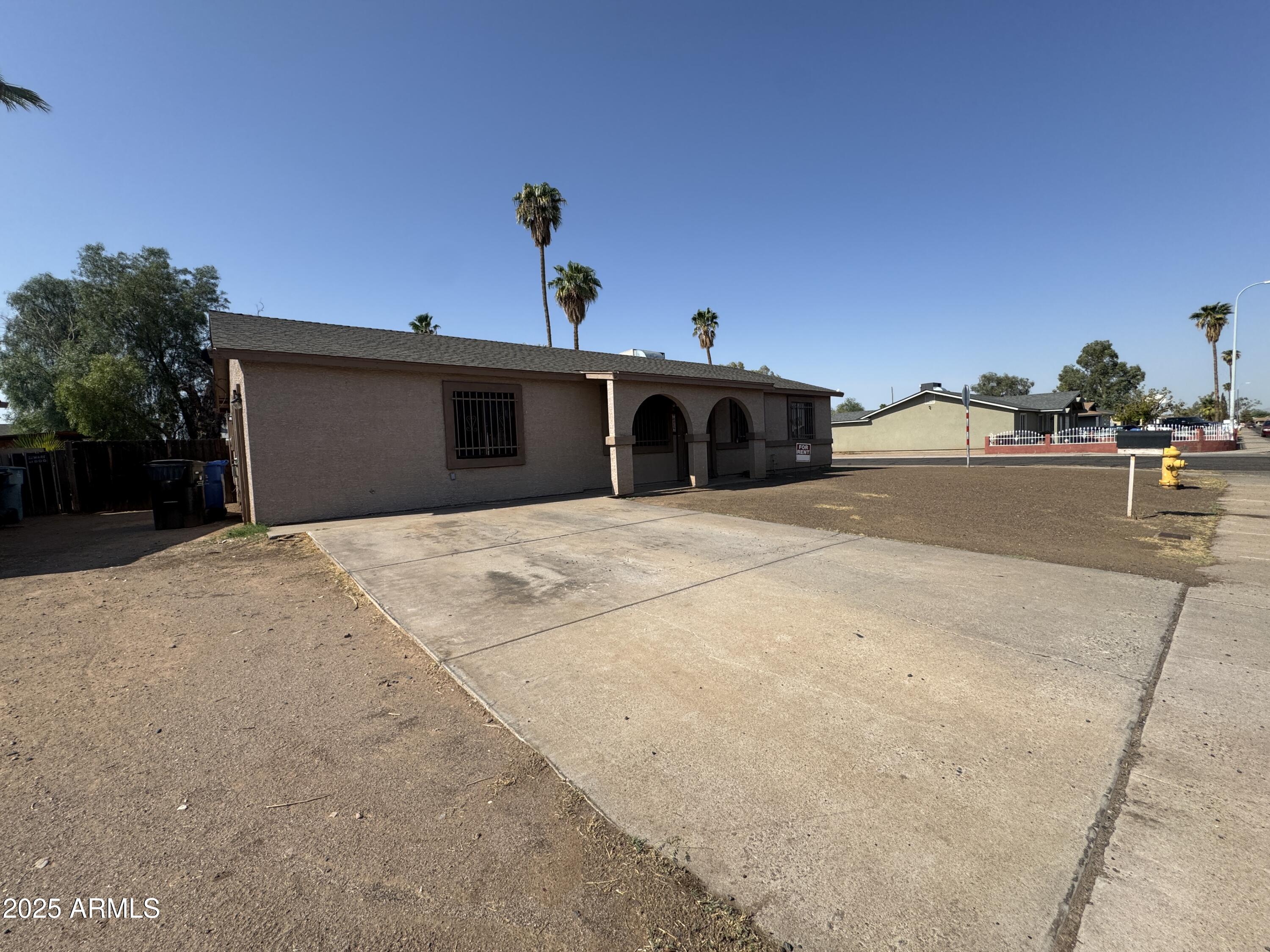7967 West Highland Avenue Phoenix, AZ 85033 - Photo 3 of 16 a view of the house with a outdoor space