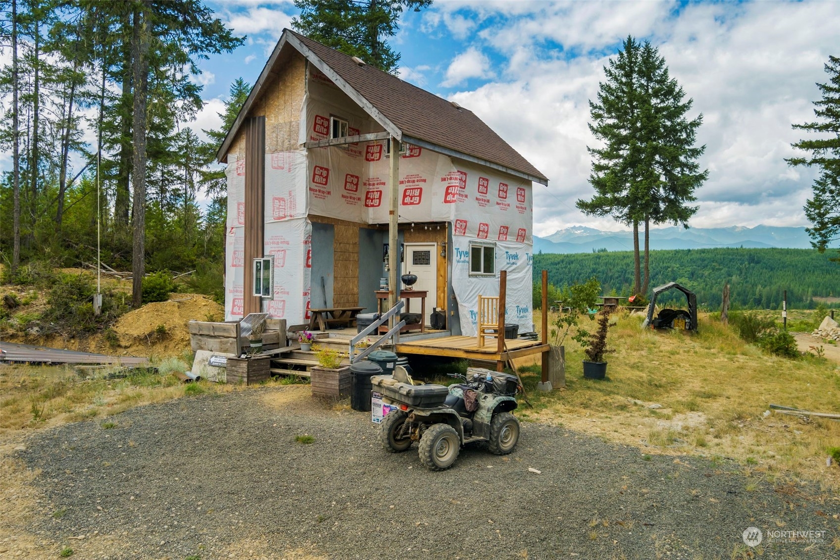 27 Northeast Dewatto Hills Road Tahuya, WA 98588 - Photo 12 of 29 a view of a house with backyard porch and sitting area