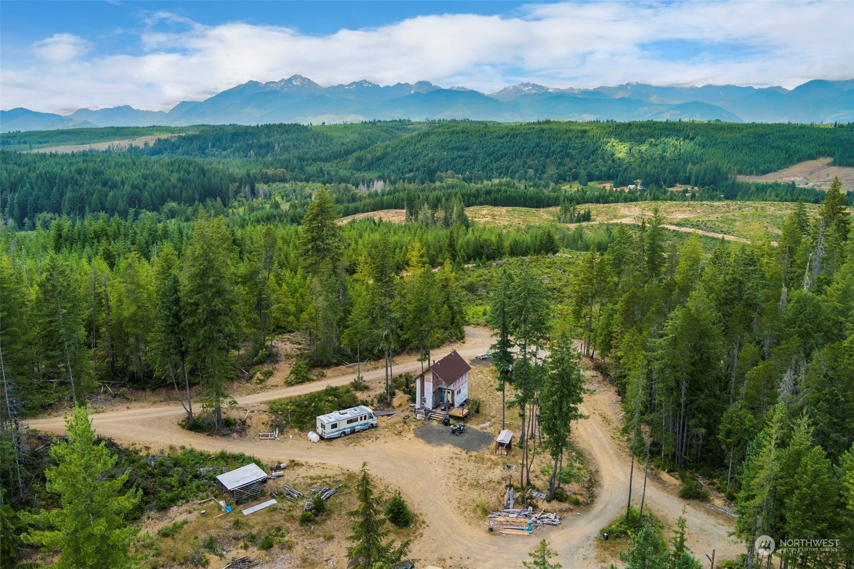 27 Northeast Dewatto Hills Road Tahuya, WA 98588 - Photo 5 of 29 a view of a lake with a mountain