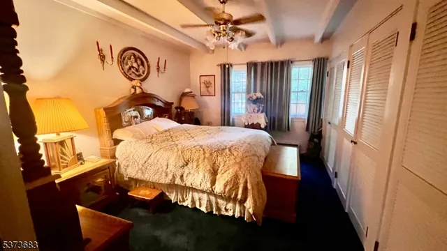 a bed room with a bed and mirror