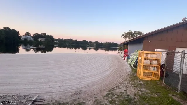 a view of a lake with houses in background