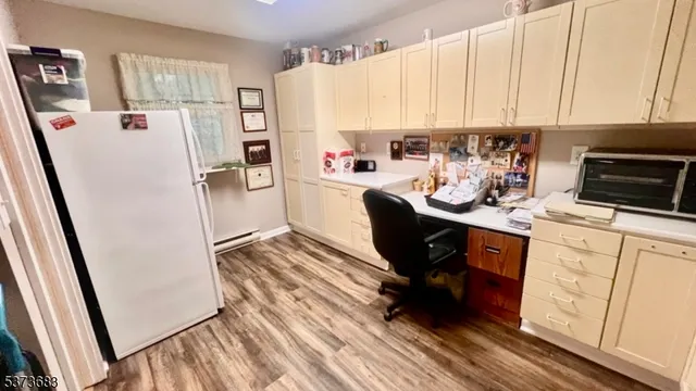 a kitchen with stainless steel appliances a refrigerator a sink a stove a microwave and cabinets