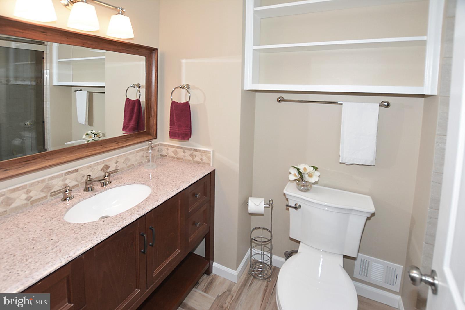 6113 Eagle Landing Road Burke, VA 22015 - Photo 24 of 41 Comfort ht vanity + built-in shelving.