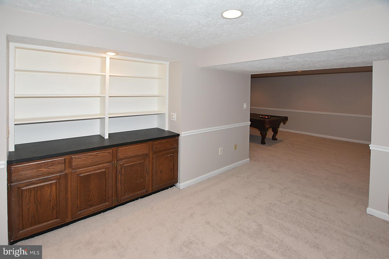 6113 Eagle Landing Road Burke, VA 22015 - Photo 33 of 41 Dry bar w/ built-in-shelving= easy entertaining.