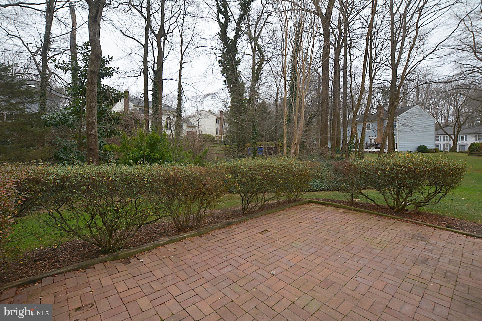 6113 Eagle Landing Road Burke, VA 22015 - Photo 38 of 41 Good-sized brick patio w/hedge surround.