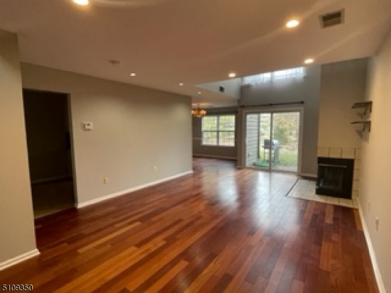 13 Andover Circle Princeton, NJ 08540 - Photo 8 of 19 wooden floor in an empty room with a window
